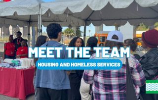 The housing and homeless team at a local event talking with community members.
